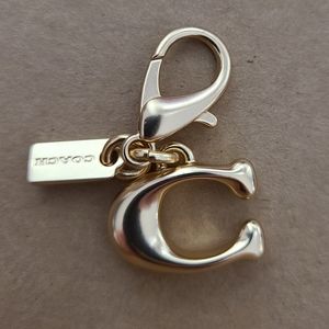 Coach charm